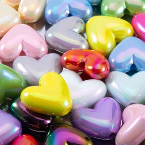 Colorful heart-shaped acrylic mabe beads with iridescent pearl finish for DIY jewelry crafts