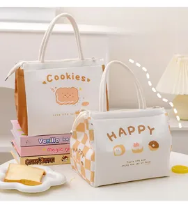 Detail of insulated lunch bags with 'Cookies' and 'HAPPY' prints and rope handles