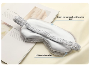 Detail of heated sleep mask with USB port and pocket for herbal inserts and heating pads