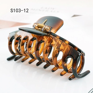 Macro side view of amber tortoise shell hair claw clip S103-12 with clear texture