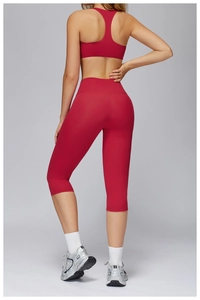 Back view of high-waist red yoga set featuring racerback top and slimming fitness leggings