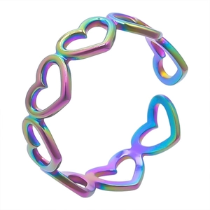 Detail of hollow rainbow heart-shaped rings with colorful anodized metallic finish