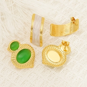 Gold plated stainless steel stud earrings with green cat eye stone and white resin C-hoops