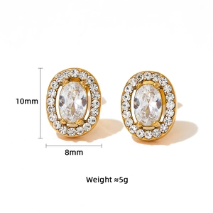 Detailed view of oval halo earrings with emerald cut cubic zirconia and gold plating