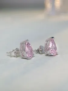 Macro detail of pear-cut pink diamond earrings featuring the S925 sterling silver hallmark
