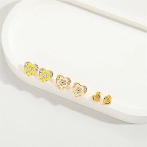 Three pairs of heart-shaped gold-plated enamel earrings with floral patterns and colorful zircons