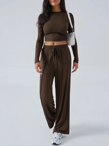 Women's 2-piece yoga set with brown long sleeve crop top and high waist wide leg pants