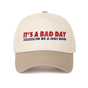 Two-tone baseball cap with It's a Bad Day to Be a Hotdog embroidery on cream crown