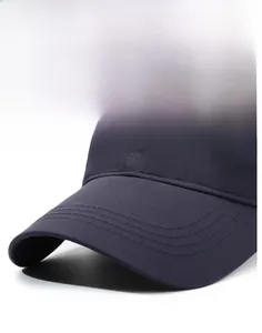 Detail of dark navy baseball cap with reinforced stitching and metal letter logo