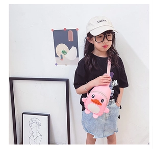 Detail showing pink duck cartoon crossbody bag with adjustable strap for kids
