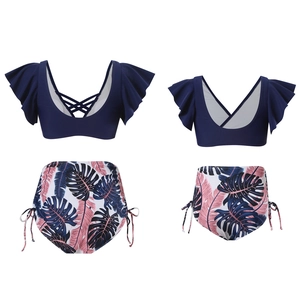Detail of two-piece swimsuit with ruffle sleeves, lace-up back and tropical print bottoms