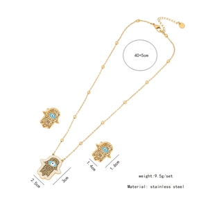 Golden Hamsa Hand jewelry set showing necklace and earring dimensions on white background