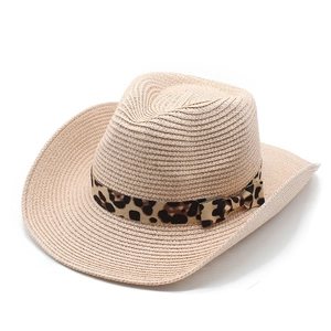 Detail of straw cowboy hat featuring leopard print ribbon and fine woven texture