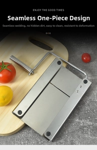 Macro shot of stainless steel cheese slicer with scale and non-slip rubber feet on wood