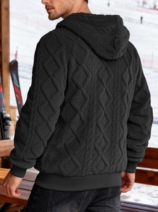 Detailed side-back view of black hooded fleece jacket with diamond quilted texture