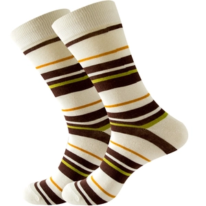 Detail of colorful striped cotton crew socks with ribbed cuffs in brown and yellow tones
