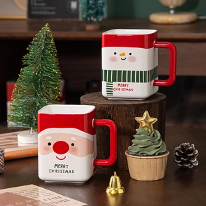 Square ceramic Christmas mugs with Santa and Snowman patterns, 80-100 characters text.