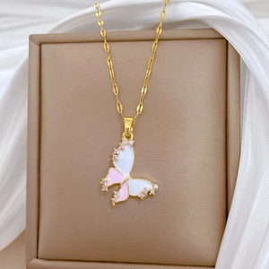 Detail of pink and white enamel butterfly pendant with sparkling diamonds on gold chain