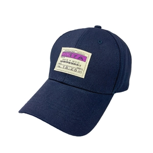 Navy blue cotton baseball cap featuring a vintage boarding pass woven patch design