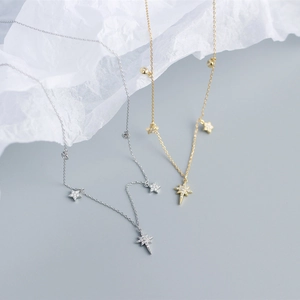 Close-up of S925 silver star pendant necklaces in gold and silver with cubic zirconia