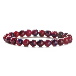 Macro shot of 8-10mm red and blue gradient natural stone beads on an elastic bracelet