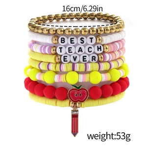 Close-up of stacked teacher-themed beaded bracelets with red apple and colorful beads