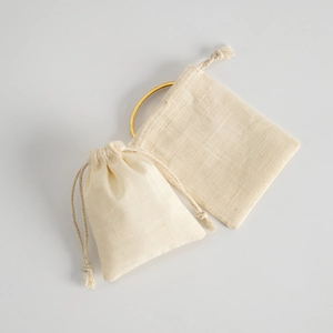 Beige cotton linen drawstring pouch for jewelry packaging and storage in minimalist style