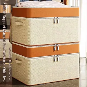 Stackable beige fabric storage bins with orange trim and reinforced handles for bedding