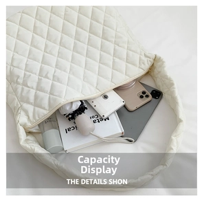 Interior storage view of white quilted crossbody bag with tablet and daily essentials