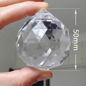 Detailed close-up of a 50mm faceted crystal prism ball showing multi-angle cut surface