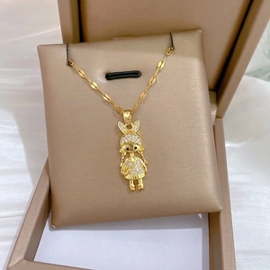 Luxurious gold necklace with a glittering crystal girl pendant on a flat link chain