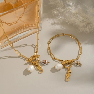 Gold OT clasp necklace and bracelet set with baroque pearls and seahorse ocean charms