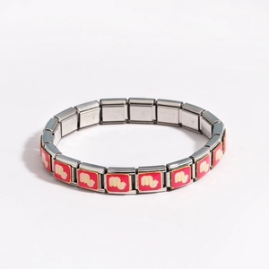 Detail of Italian charm bracelet with Scorpio zodiac sign in pink enamel and gold trim