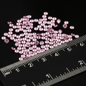 Pink cubic zirconia round cut loose gemstones shown with scale for nail art DIY