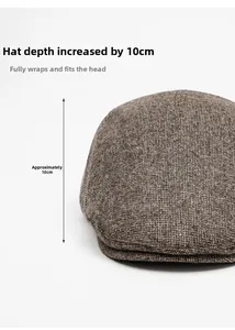 Detail showing 10cm depth of dark brown knitted newsboy hat with textured fabric