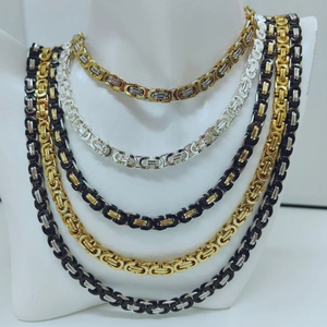 Byzantine chain necklaces for men in gold and silver colors on mannequin neck display