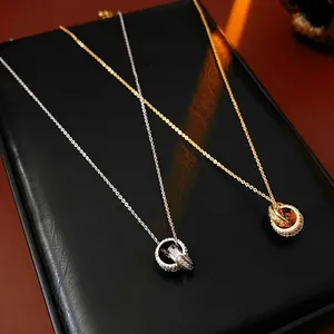 Elegant 18K gold plated interlocking circle necklace with sparkling cubic zirconia pavé