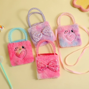 Flat lay of colorful plush bunny bags with sequin bows for girls in pink and purple