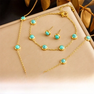 Detailed set of vintage turquoise necklace, bracelet and earrings in gold-plated steel