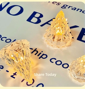 Detail of warm yellow LED iceberg lamps with crystalline faceted texture for home decor
