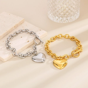 Polished stainless steel heart pendant bracelets in gold and silver with toggle clasp