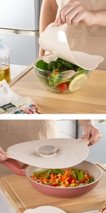 Versatile silicone lids shown sealing a salad bowl and a frying pan in a warm kitchen