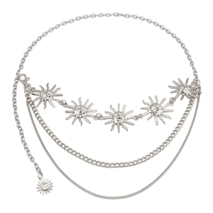Detail of silver multi-layered metal waist chain featuring ornate sun charms