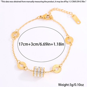 Detail showing gold bracelet length of 17cm plus 3cm with sparkling crystal charms