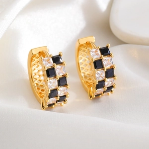 Minimalist checkerboard pattern hoop earrings with black and white cubic zirconia stones