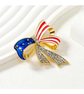 Detail of American flag bow brooch with blue enamel stars and red white stripes