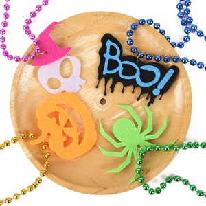 Halloween felt necklaces featuring pumpkin and skull pendants with colorful beaded chains