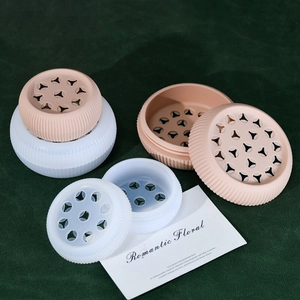 Spiral silicone flower stem holder in pink and white for elegant bouquet arrangements
