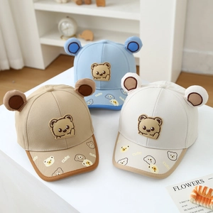 Detailed view of kids baseball caps featuring 3D bear ears and cute printed brims