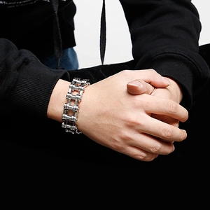 Macro detail of industrial steel bike chain bracelet with cool metallic highlights